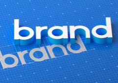 This visual showcases the process of creating a brand through a 3D text design that emerges from a draft, emphasizing the development of brand identity and the establishment of brand culture. The scene illustrates how a brand concept evolves into a complete identity, highlighting the importance of design and strategic branding in shaping a brand's image and culture. The 3D rendering offers a dynamic view of brand creation, from initial design to final brand development.